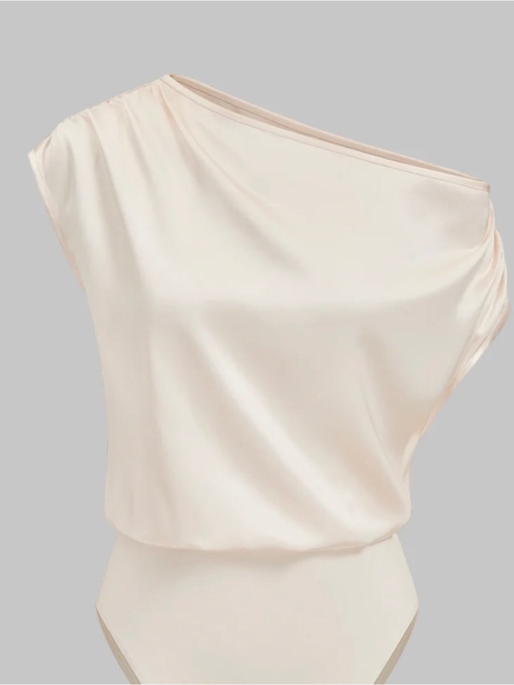 One-Shoulder Cream Bodysuit with Draped Silhouette